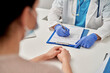 © Westend61 - Medical professional prescribing new treatment to patient