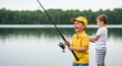 © Hungarian - Happy Young Boys Enjoying a Day of Fishing by the Calm Lake During Summer Vacation