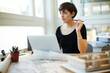 © Westend61 - Architect sitting at desk looking through window