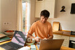 © Alba Vitta Studio/Stocksy - Working on a Project at a Kitchen Table