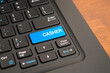 © Akmalism Photography - Close up of a computer keyboard with a blue cashier key, representing retail transactions, payment processing, checkout operations, point of sale systems, and business finance concepts.