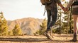© MT - Young couple hiking together holding hands on mountain trail, active lifestyle concept, outdoor adventure travel with backpacks