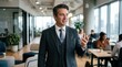 © MDALIF - Confident business person in modern office environment gesturing professionally