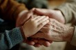 © kale.studio - Closeup of a childs hand on top of an elderly persons hand
