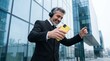 © BusTech - Young entrepreneur business man listening to music and dance