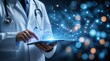 © Rhony - Doctor uses a tablet that emits a complex, glowing network of digital data consisting of connected dots and lines.