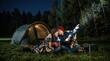 © ARTenyo - Night camping adventure with children, young boys sitting by tent with flashlights in dark forest, kids exploring nature under starry sky
