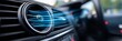 © Ilja - Close-Up of a Modern Car Air Conditioning Vent Panel with Cool Flowing Blue Air Currents Inside