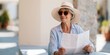 © perfectlab - Mature woman with map outdoors