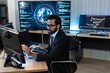 © winnievinzence - IT director holds tablet while analyzing global cyber code network data inside security operation center command