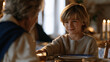 © forenna - A child at a Jewish new year dinner table sliding a honey jar toward a grandparent who has paused mid-conversation, the small gesture of connection at Rosh Hashanah captured at