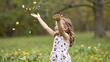 © Studicon - Little girl throwing flower petals in the air on a sunny day in spring