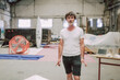 © Luciano Spinelli/Stocksy - Barber Prepares for haircut in Industrial Space