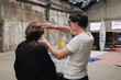 © Luciano Spinelli/Stocksy - Hair Styling Session in an Industrial Studio