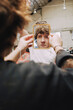 © Luciano Spinelli/Stocksy - Young Man Looking Into a Small Mirror