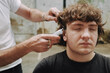 © Luciano Spinelli/Stocksy - Contemporary Haircut in a alternative Salon