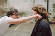 © Luciano Spinelli/Stocksy - Haircut Session in an Industrial Studio