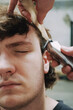 © Luciano Spinelli/Stocksy - Haircut close up portrait