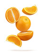 © Berzyk - Floating oranges and slices isolated on white background