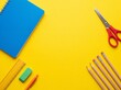 © AdPremium - School and office supplies flat lay on yellow background with central copy space