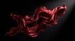 © AdPremium - Elegant red satin fabric flowing gracefully in the air against a solid black background with dramatic lighting