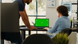 © DC Studio - Business team analyzing green screen on laptop display, brainstorming new ideas and working on startup operations.