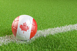 Football / soccer ball with a flag overlay of Canada match and national team of Canada concept