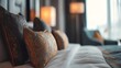 © Plaifah - Luxurious hotel room with elegant pillows and soft lighting, showcasing comfort and style for a sophisticated interior design ambiance