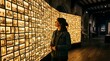 © Wool World - Woman Observing Illuminated Historical Photographic Wall Display in Museum