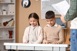 © Pixel-Shot - Young children learning piano with teacher, music education and skill development, creative arts and childhood development