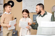 © Pixel-Shot - Music teacher guiding young students with sheet music during piano lesson, educational development and creative learning