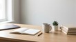 © velikiyzayats - Minimalist home office desk setup with open notebook and laptop for remote work productivity and study planning in a bright modern workspace