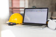 © Westend61 - Laptop, yellow hardhat, walkie talkie and vr glasses