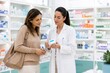 © fiore26 - Pharmacist advising customer about medicine in drugstore