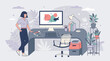 © Wowooo - A woman stands casually by her modern office desk with a computer displaying abstract design in a creative workspace.
