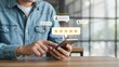 © Ranju - Man using smartphone to give a five star rating for customer service satisfaction