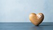 © Kamranazhar - Wooden heart with adhesive bandage symbolizing healing recovery care and emotional support