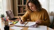 © phj.domingos - Young woman diligently organizing notes and planning tasks in her planner