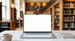 © Paul - Minimalist workspace featuring a modern laptop with a blank screen and blurred bookshelf background.