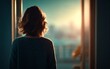 © PRI - Young Woman Standing at Threshold with Back View During Sunset Glow