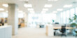 © birulaut - A blurred image of a modern office interior showcasing desks, plants, and bright lighting, creating a professional and inviting atmosphere.