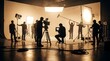 © Pixim Stock - Professional film crew setting up lights and camera equipment on a film set, preparing for a shoot with actors and crew.