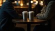 © Nijika - tavern. Two companions sharing a moment over frosted beverage glasses on a wooden table in warm light. bar promotions, beverage menus, designed for food & beverage menus and cafe branding.
