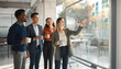 © InfinityVisuals - Team Brainstorming Session: A diverse group of business professionals collaborates around a glass board filled with sticky notes.