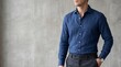 © Ruslan Abdullin - Man in stylish blue linen shirt and grey trousers smart casual