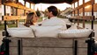 © Anna - Young couple laughing in the back of a wooden truck at sunset. Man and woman on a romantic road trip in a rural village. Golden hour travel concept