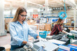 © bulentbaris - Women working on assembly line in factory, manufacturing small parts