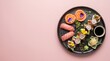 © dina - Gourmet Sushi Platter with Salmon Roses, Tuna Nigiri, and Maki Rolls Decorated with Edible Flowers on Black Plate, Pastel Pink Background, High-End Fine Dining Food Photography.