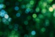 © M Halim Abduh - Abstract green bokeh lights creating a vibrant natural background with soft glowing orbs