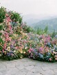 © Zhang - Lush Colorful Flower Garden Overlooking Misty Mountain Valleys